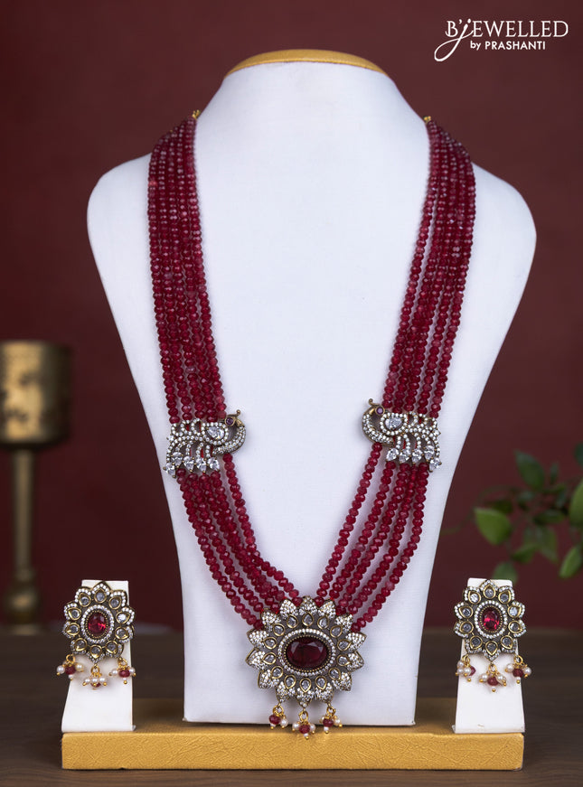 Beaded maroon necklace peacock design with ruby & cz stones and pearl & beads hanging in victorian finish
