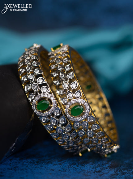 Zircon bangle with green and cz stones in gold finish