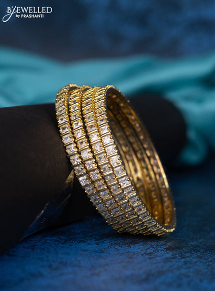 Zircon bangle with cz stones in gold finisH