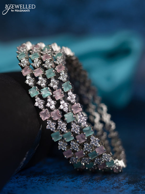 Zircon bangle with mnit green and baby pink stones