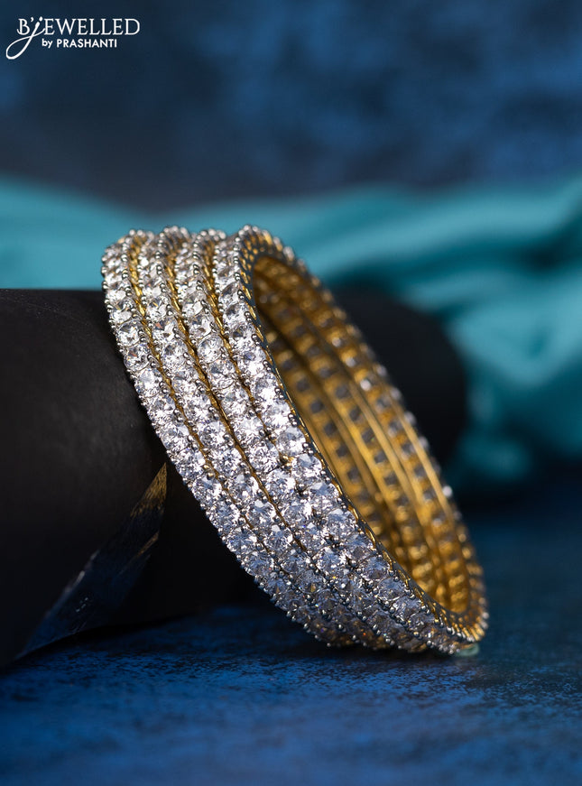 Zircon bangle with cz stones in gold finisH