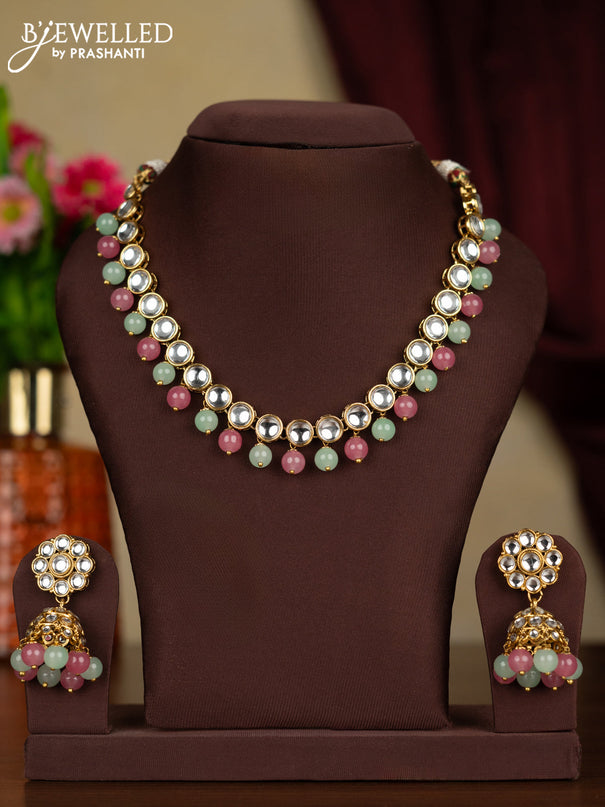 Kundan necklace with pink and mint green beads hanging