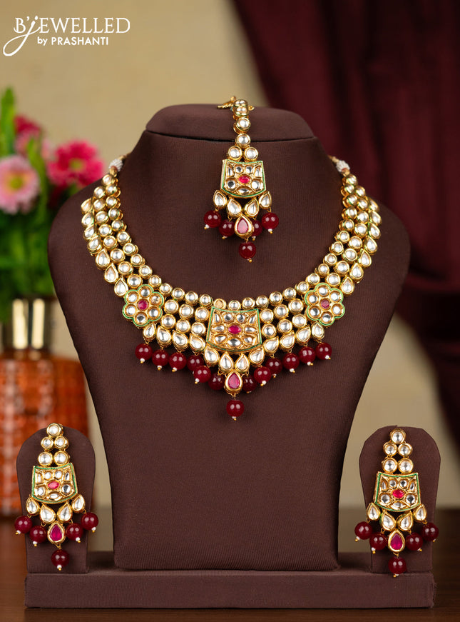 Kundan necklace ruby stones with maang tikka and maroon beads hanging