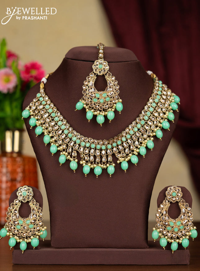 Kundan necklace mint green stones with maang tikka and pearl & mint green beads hanging
