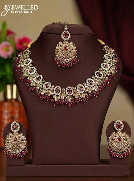 Kundan necklace ruby stones with maang tikka and pink beads hanging