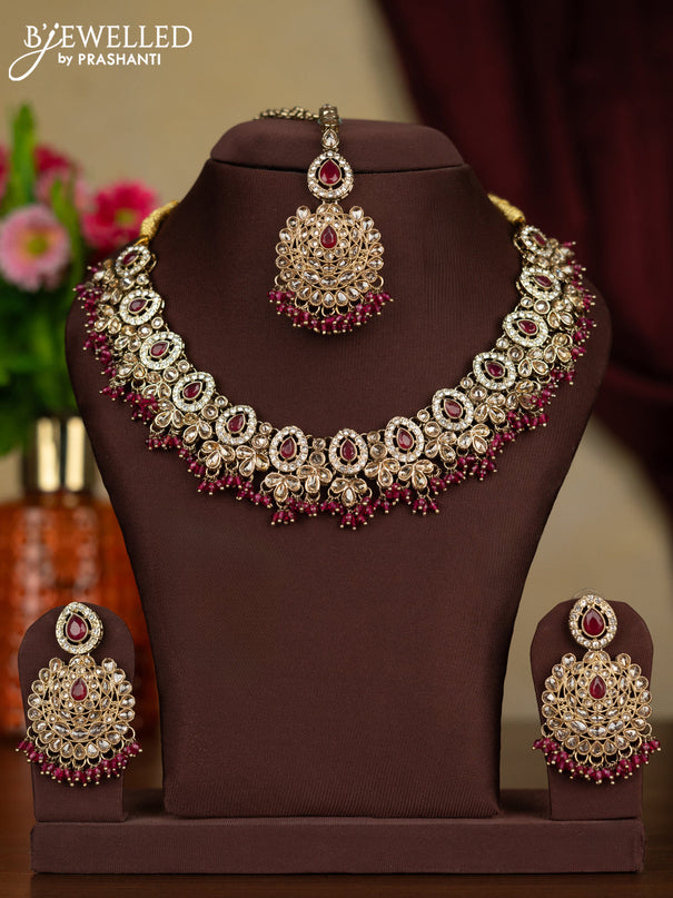 Kundan necklace ruby stones with maang tikka and pink beads hanging