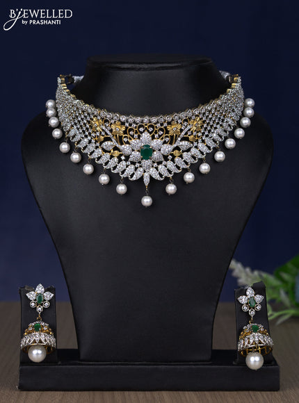 Zircon choker floral design with emerald & cz stones and pearl hangings in gold finish