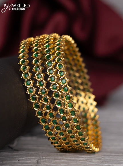 Antique bangle with green kemp stones