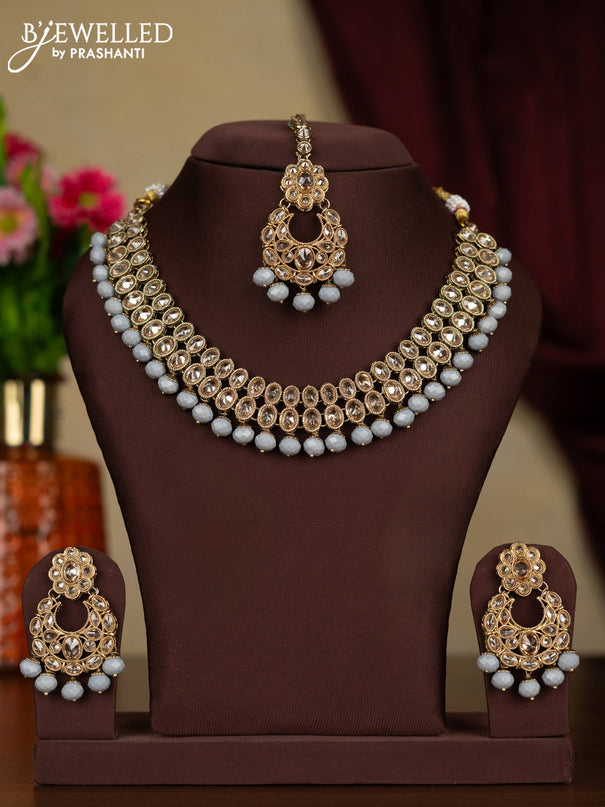 Kundan necklace with maang tikka and grey beads hanging