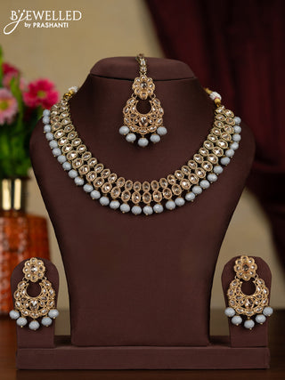 Kundan necklace with maang tikka and grey beads hanging