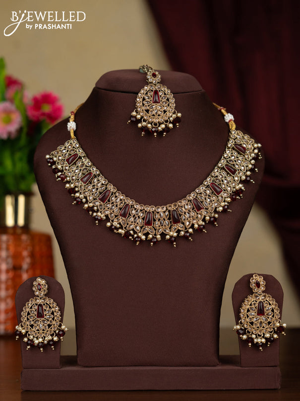Kundan necklace ruby stones with maang tikka and pearl & maroon beads hanging