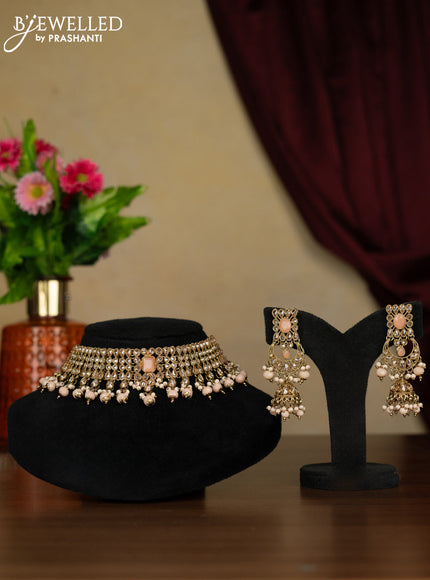 Kundan necklace with peach stones and peach beads hanging