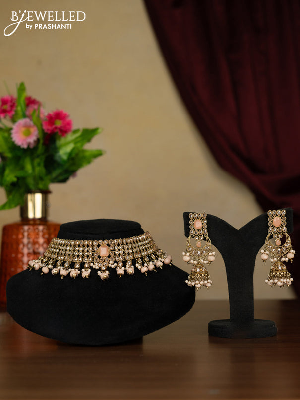 Kundan necklace with peach stones and peach beads hanging