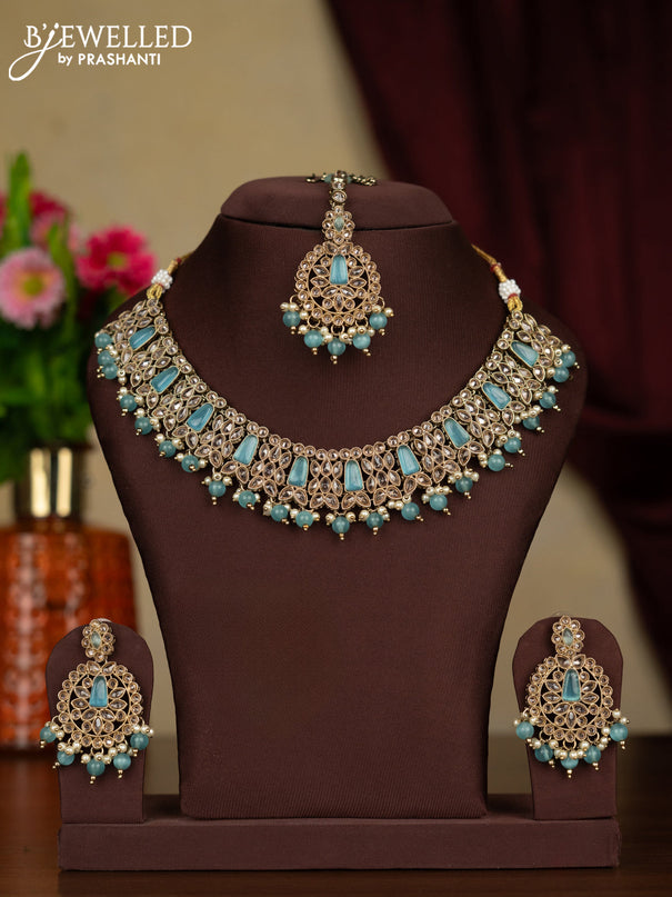 Kundan necklace ice blue stones with maang tikka and pearl & ice blue beads hanging