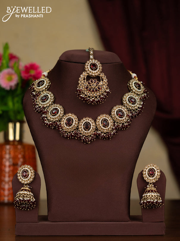 Kundan necklace ruby stones with maang tikka and pearl & maroon beads hanging