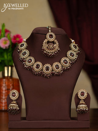 Kundan necklace ruby stones with maang tikka and pearl & maroon beads hanging