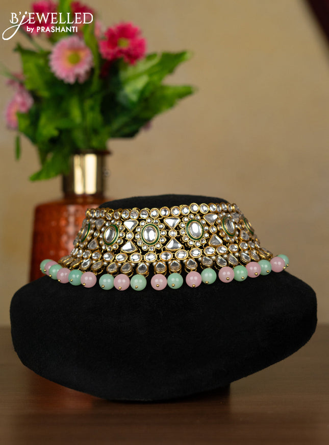 Kundan necklace with maang tikka and baby pink & mint green beads hanging