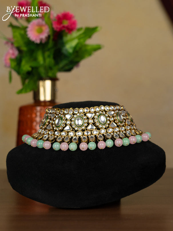 Kundan necklace with maang tikka and baby pink & mint green beads hanging