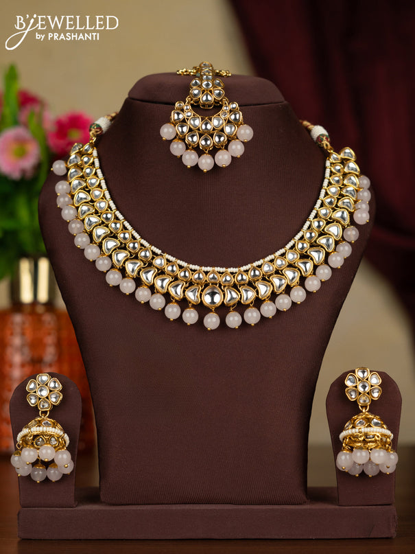Kundan kundan necklace with maang tikka and baby pink beads hanging