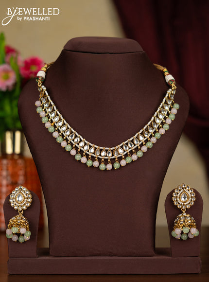 Kundan necklace with maang tikka and baby pink & mint green beads hanging