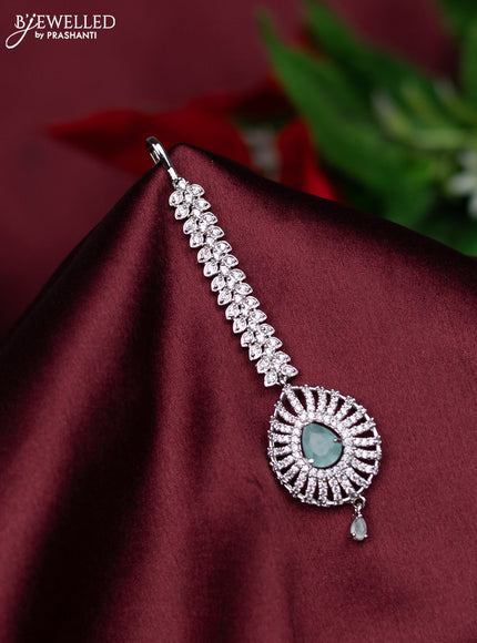 Zircon maang tikka with mint green & cz stones and hanings