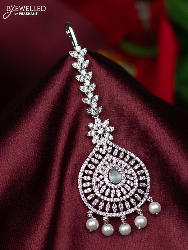 Zircon maang tikka with mint green & cz stones and pearl hanings