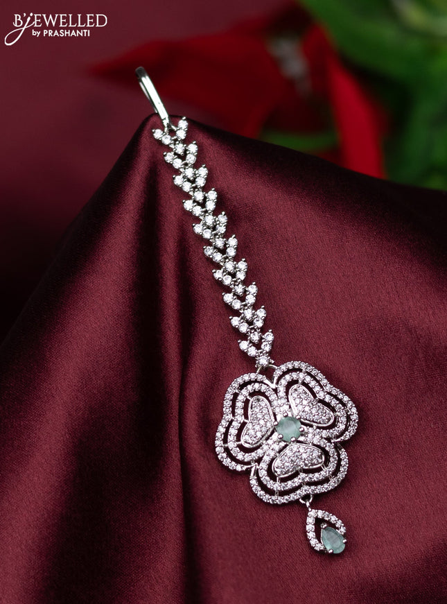 Zircon maang tikka floral design with mint green & cz stones and hanings