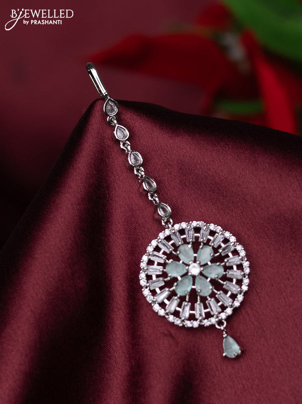 Zircon maang tikka floral design with mint green & cz stones and hanings