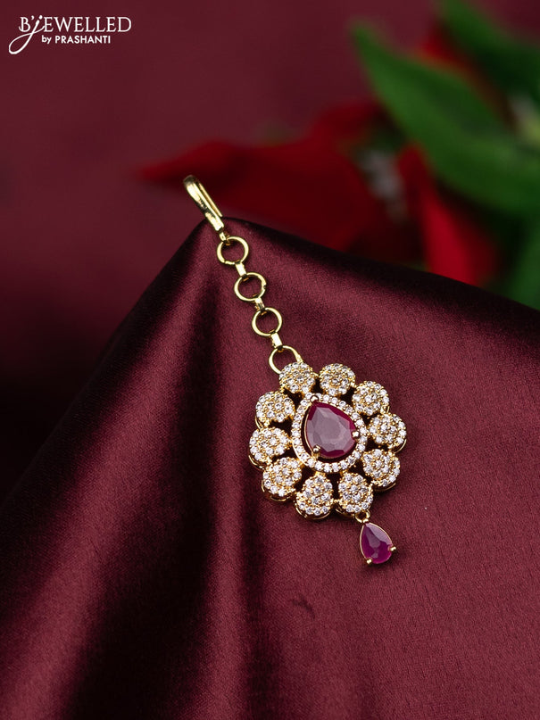 Zircon maang tikka with ruby & cz stones and hanings in gold finish