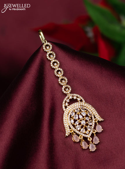 Zircon maang tikka with baby pink & cz stones and hanings in gold finish