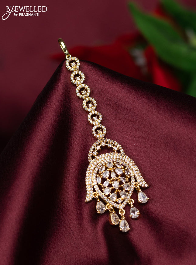 Zircon maang tikka with cz stones and hanings in gold finish
