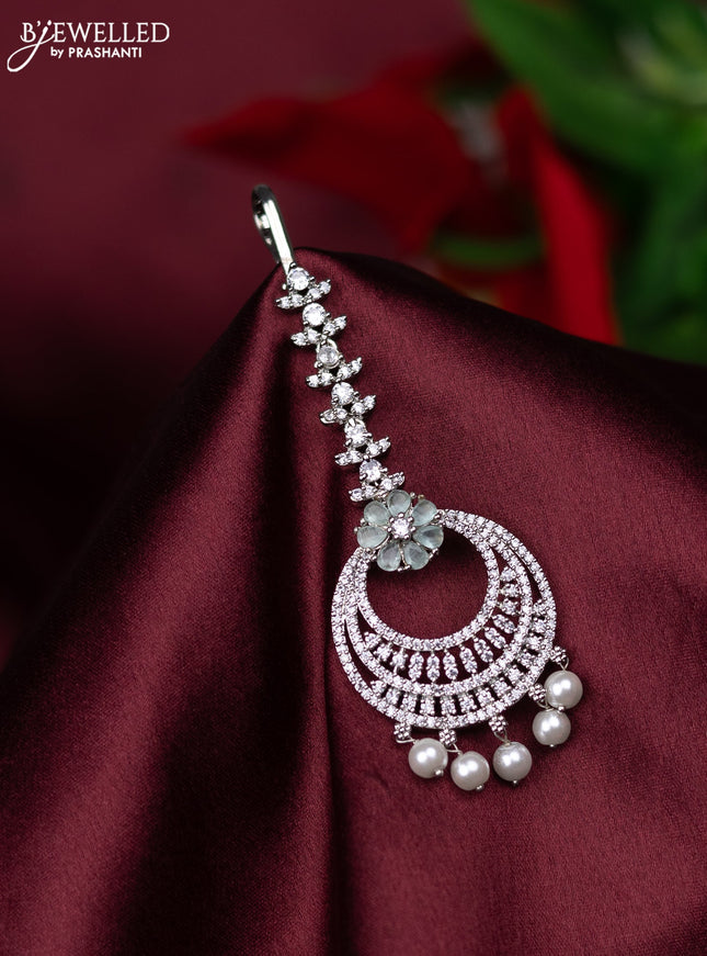 Zircon maang tikka with mint green & cz stones and pearl hanings