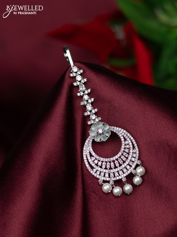 Zircon maang tikka with mint green & cz stones and pearl hanings