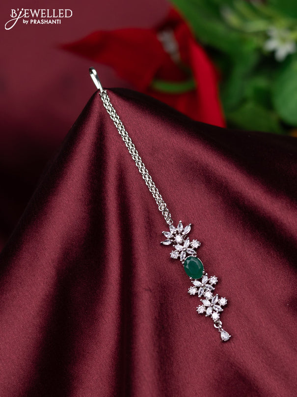 Zircon maang tikka floral design with emerald & cz stones and hanings