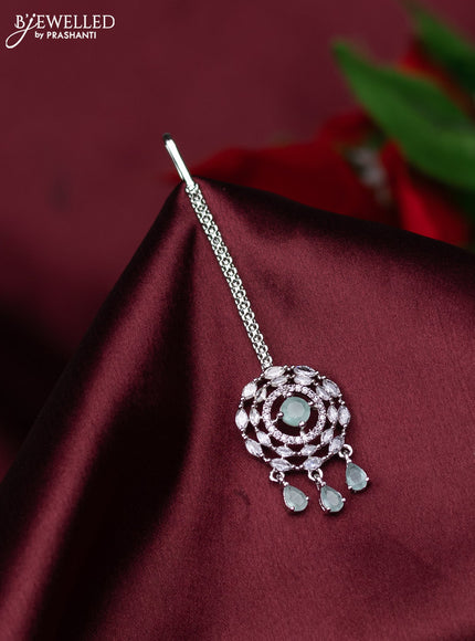 Zircon maang tikka with mint green & cz stones and hanings