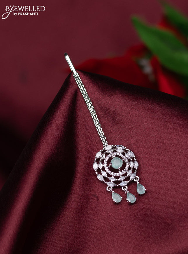 Zircon maang tikka with mint green & cz stones and hanings