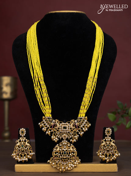 Jaipur multilayer beaded yellow necklace with peacock pendant and pearl hangings