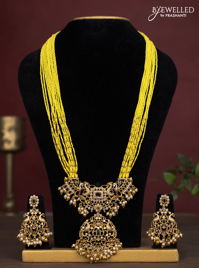 Jaipur multilayer beaded yellow necklace with peacock pendant and pearl hangings