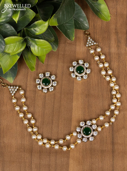 Pearl choker with emerald and cz stone
