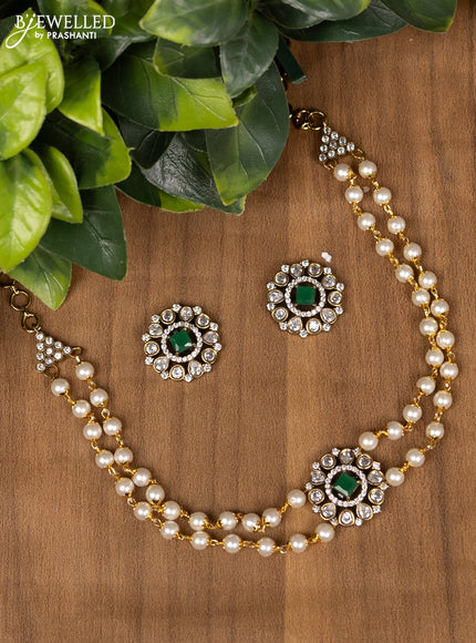 Pearl choker with emerald and cz stone