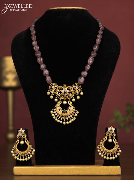 Beaded light brown necklace peacock design pendant with kemp & cz stones and pearl hangings