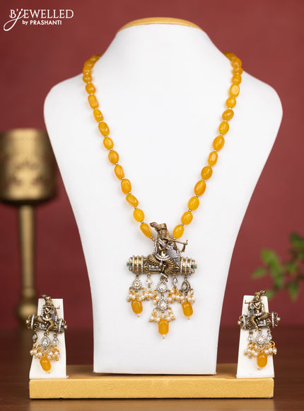 Beaded yellow necklace krishna pendant with cz stones and pearl hangings