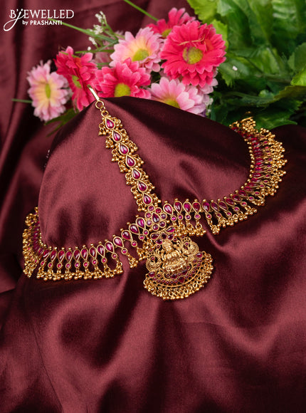 Antique maang tikka lakshmi design with pink kemp stones and golden beads hanging