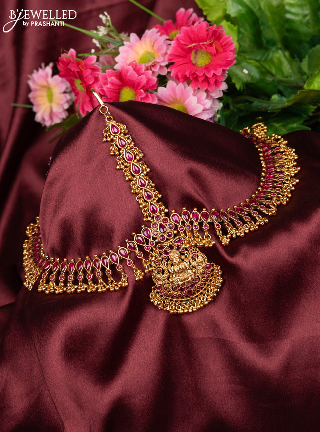 Antique maang tikka lakshmi design with pink kemp stones and golden beads hanging