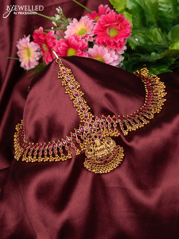 Antique maang tikka lakshmi design with pink kemp stones and golden beads hanging
