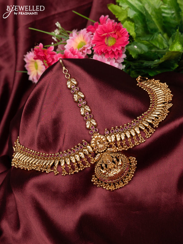 Antique maang tikka lakshmi design with pink kemp stones and golden beads hanging