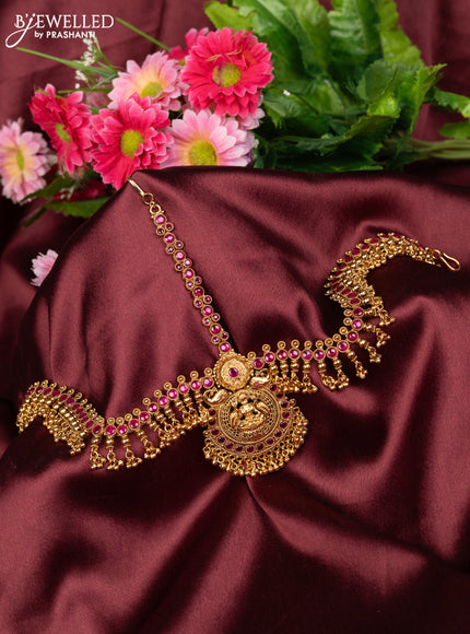 Antique maang tikka lakshmi design with pink kemp stones and golden beads hanging