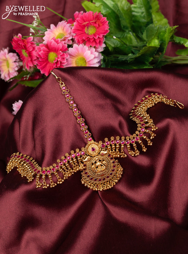 Antique maang tikka lakshmi design with pink kemp stones and golden beads hanging