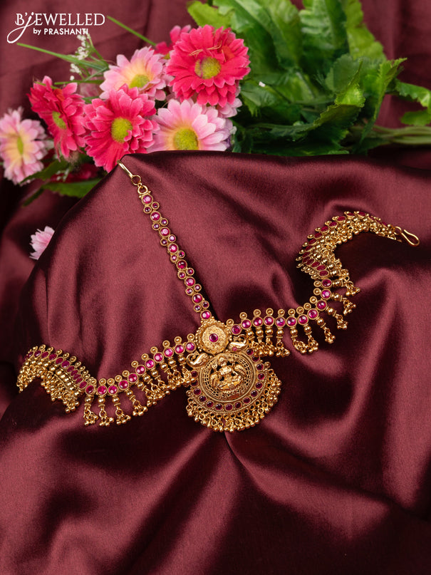 Antique maang tikka lakshmi design with pink kemp stones and golden beads hanging