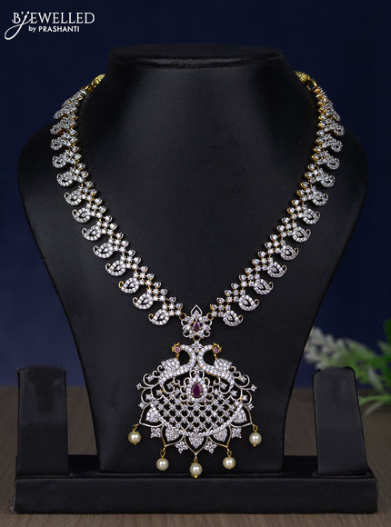 Zircon necklace peacock design with ruby & cz stones and pearl hangings in gold finish without earring